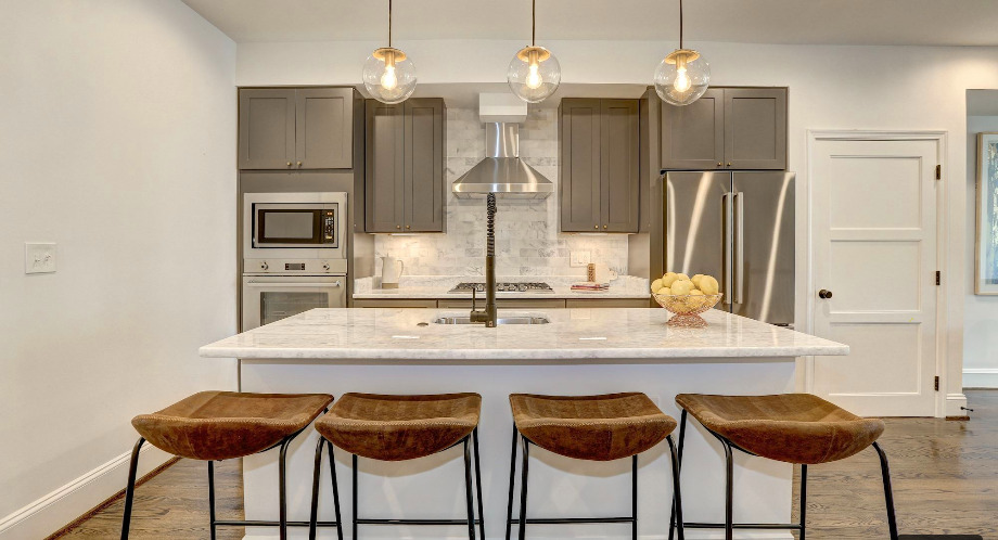 white kitchen remodel with bar stools at island in mission hills kitchen remodel